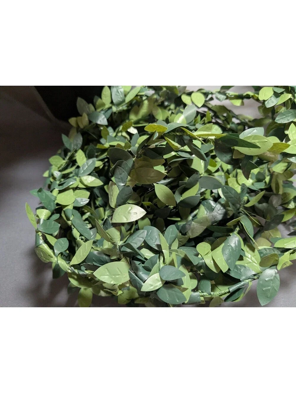 Artificial Flower Arrangement with Decorative Greenery and Shredded Paper Filler